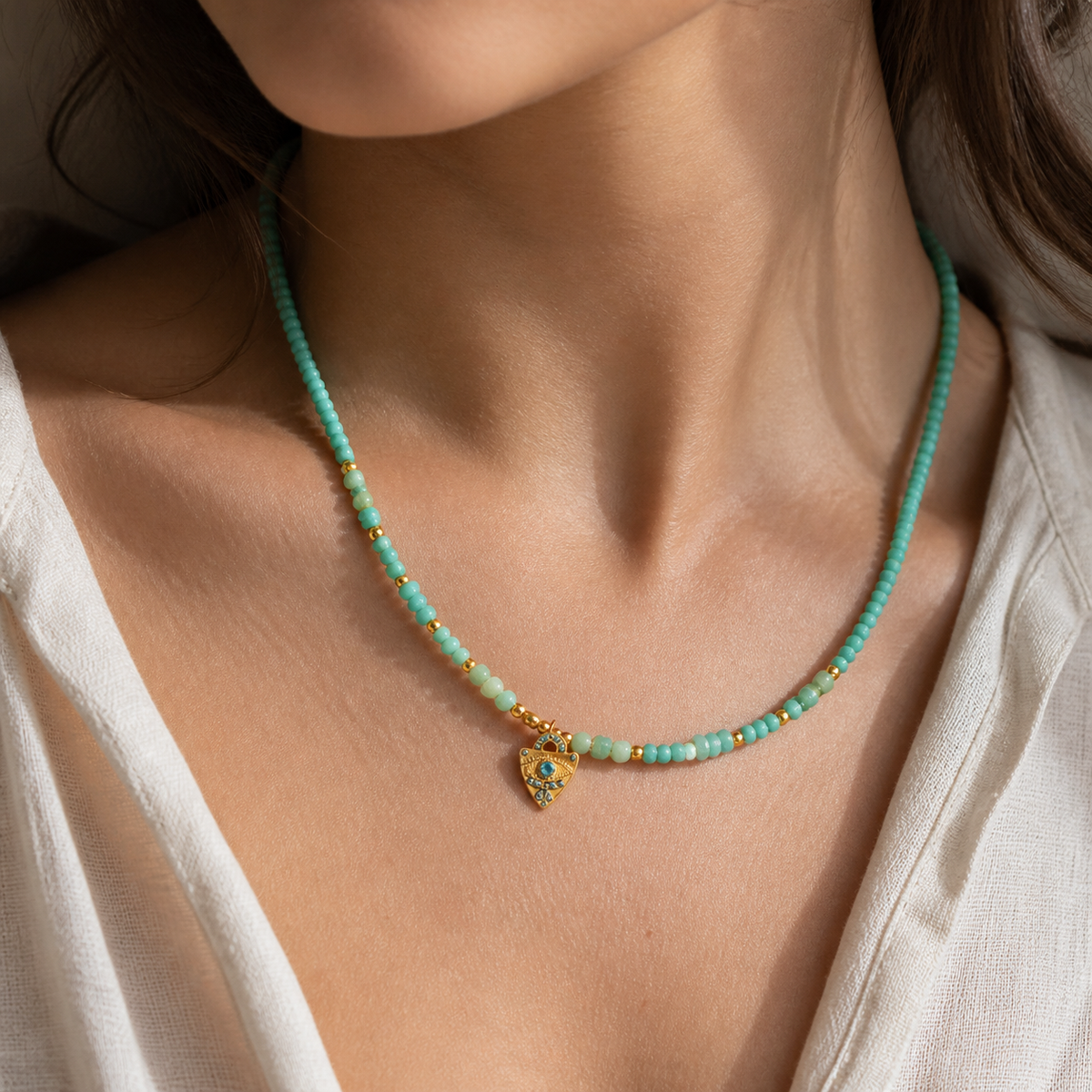 Blue Heartstrand Necklace worn in a natural editorial portrait