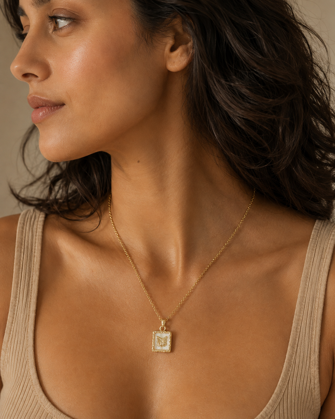 Side-profile portrait featuring the Butterfly Memento Pendant Necklace and its vertical butterfly pendant.