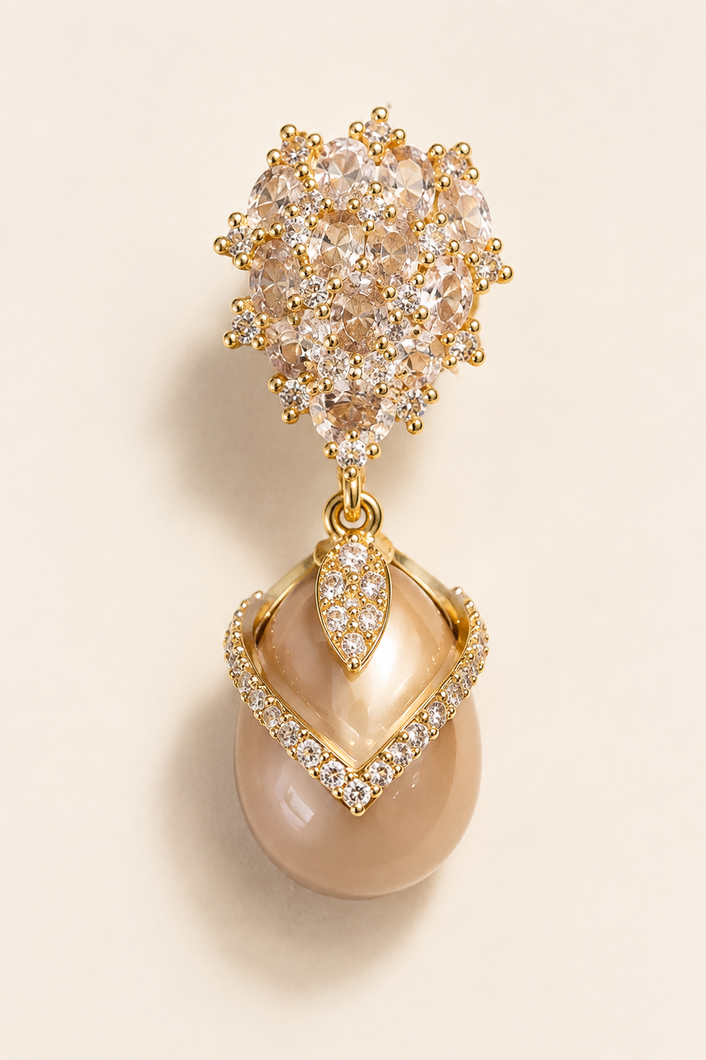 Close view of a Misted Votive Earring showing the irregular top cluster, leaf-shaped accent, open tilted diamond frame, and pearl drop.