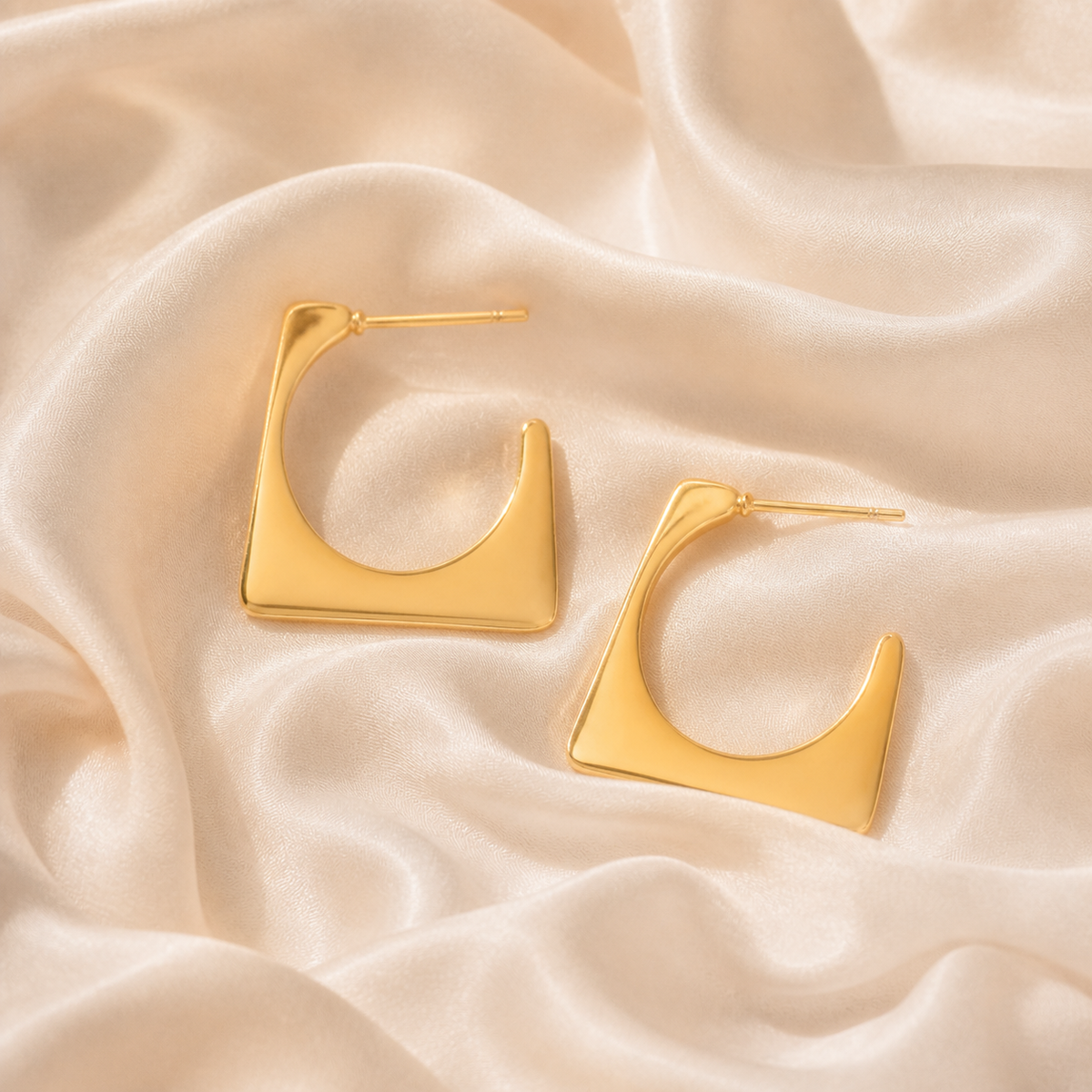 Ember Portal Earrings styled on Moonveil warm cream silk
