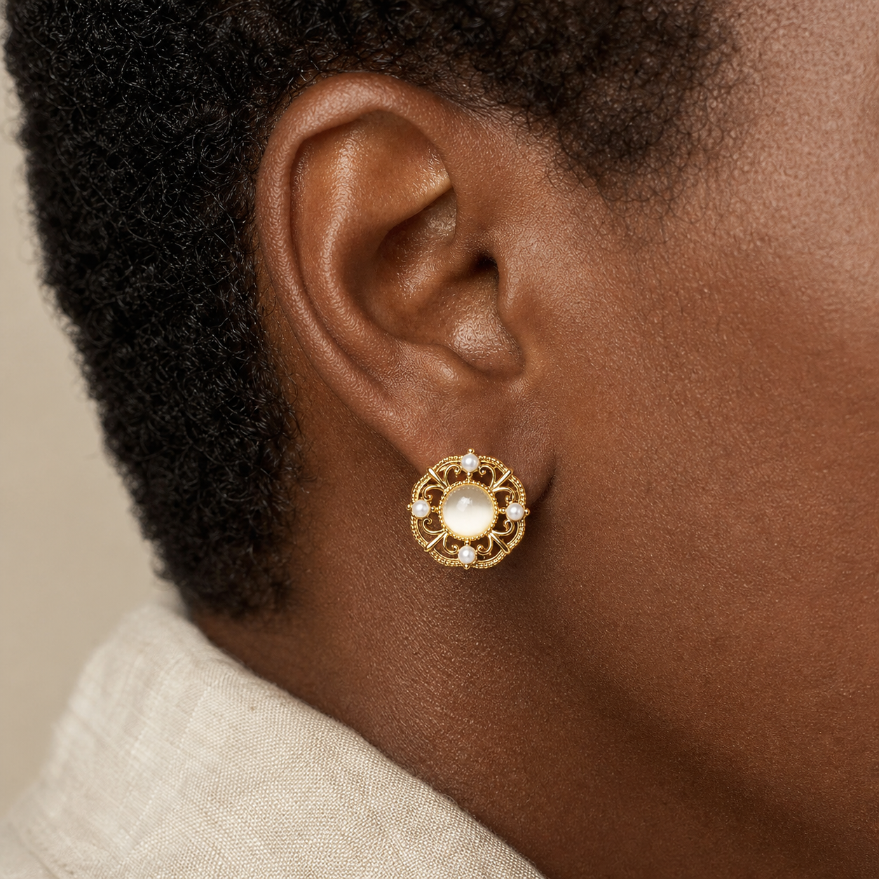 Filigree Orbit Stud Earrings worn in a natural editorial portrait
