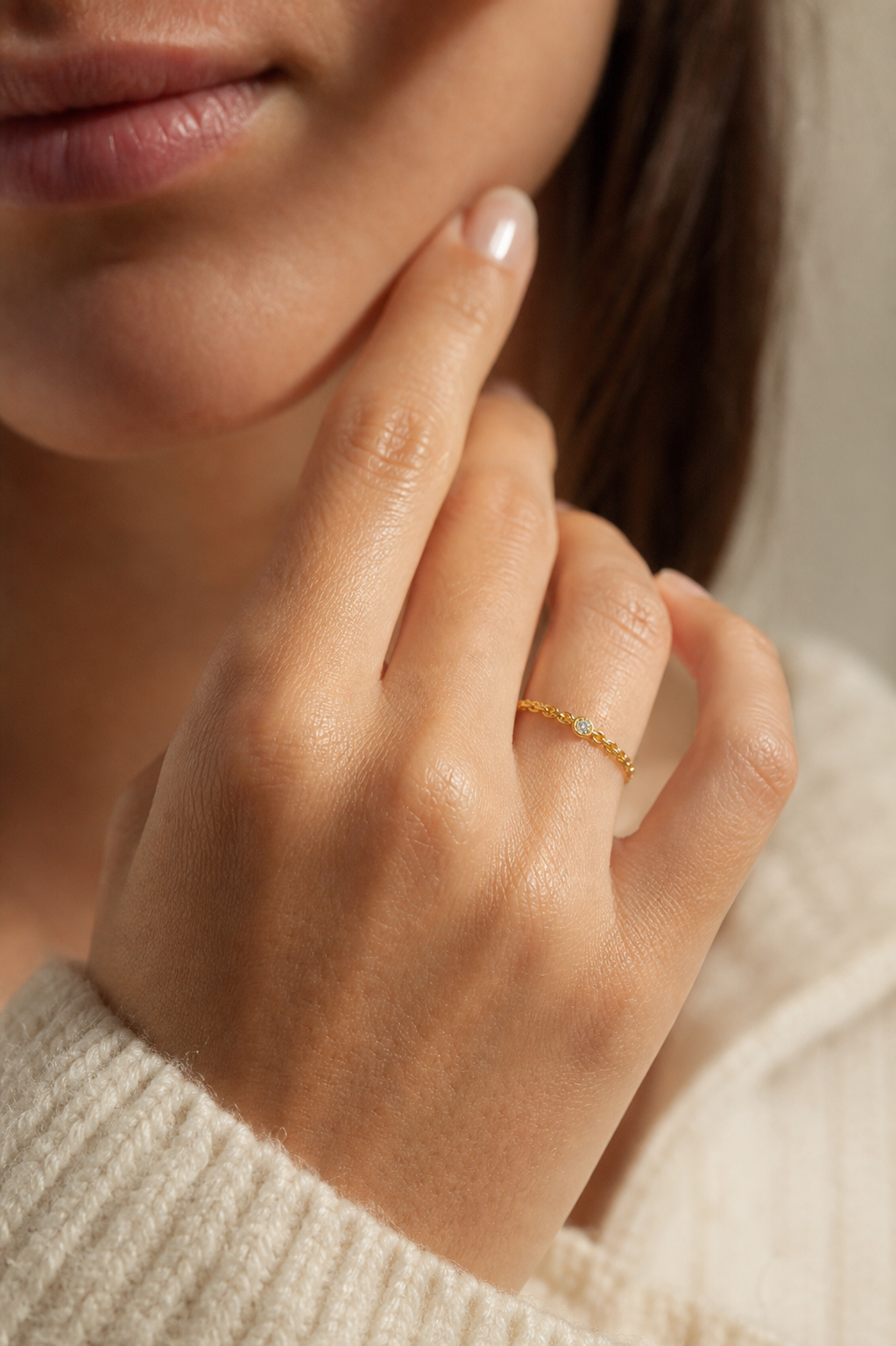 Golden Link Solitaire Ring worn on a hand in warm natural light