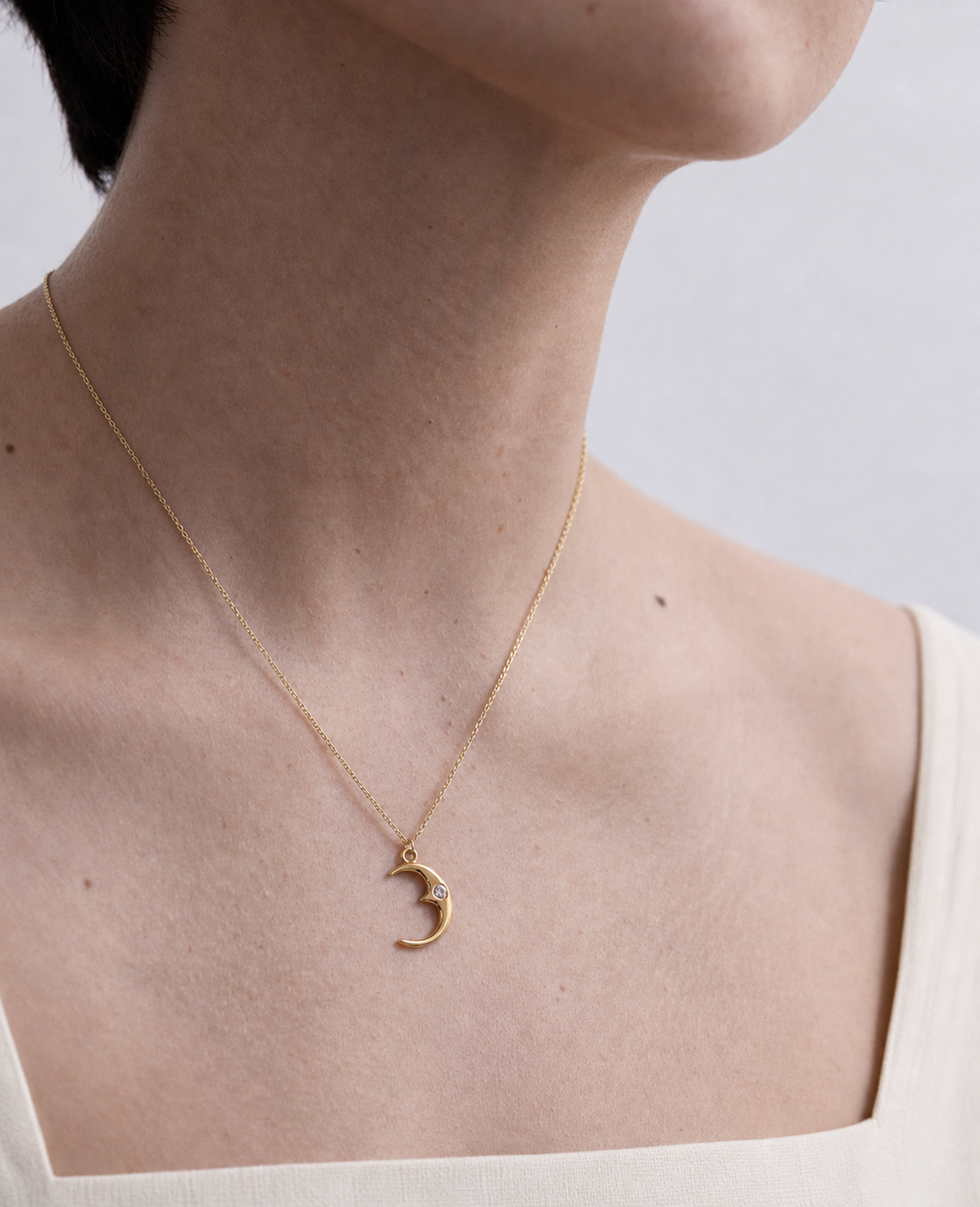 Nightfall Crescent Necklace worn in a natural editorial portrait