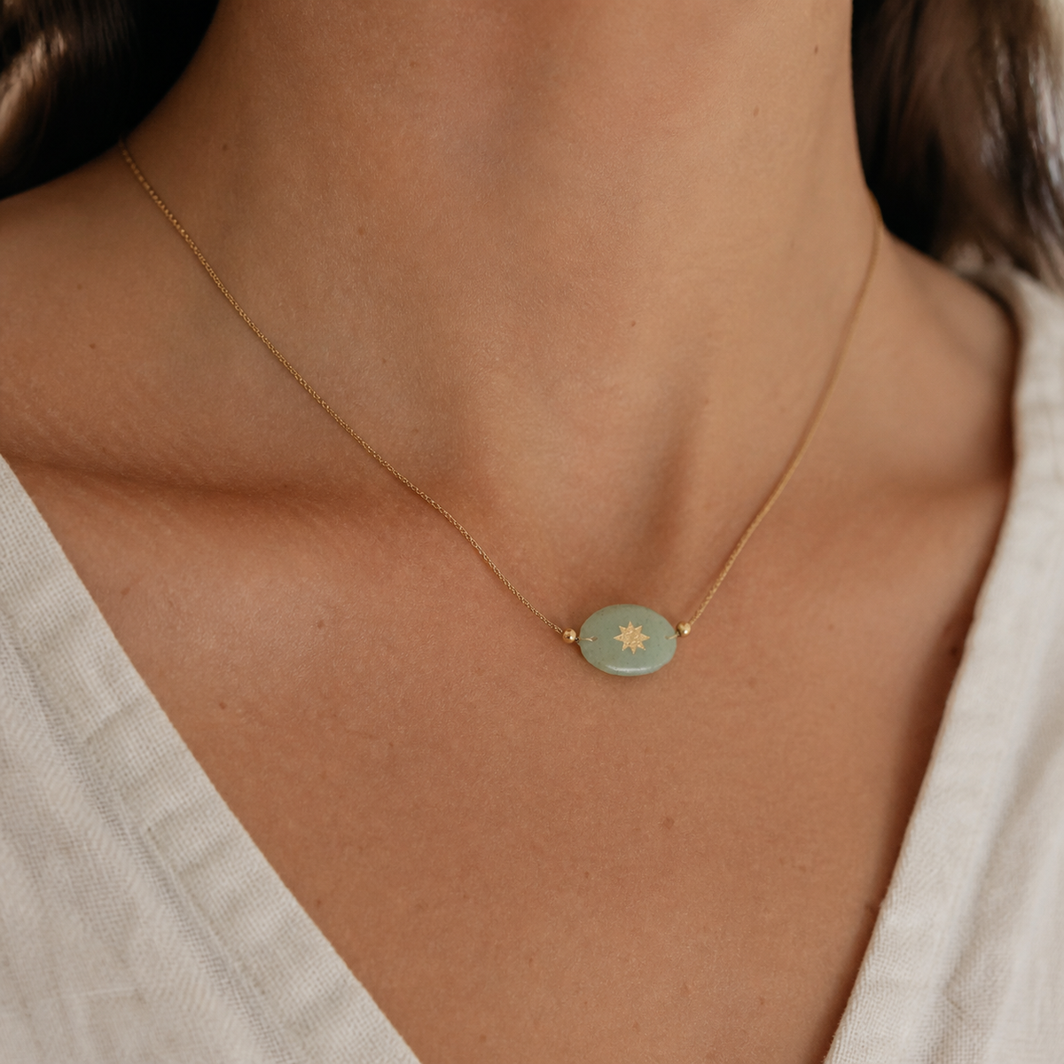 Quiet Solar Oval Necklace worn in a natural editorial portrait