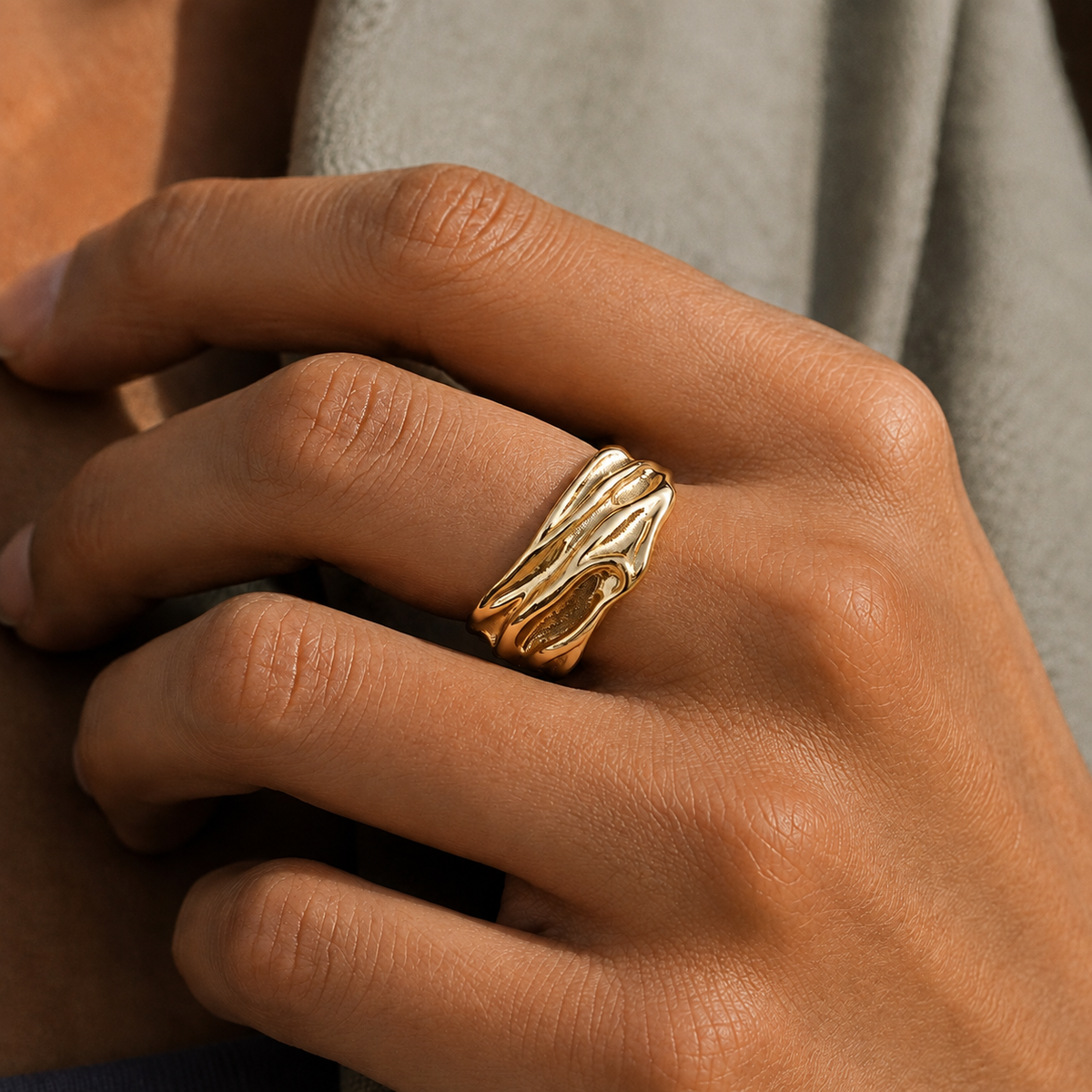 Riverfold Open Ring worn in a partial-face directional-light editorial close crop