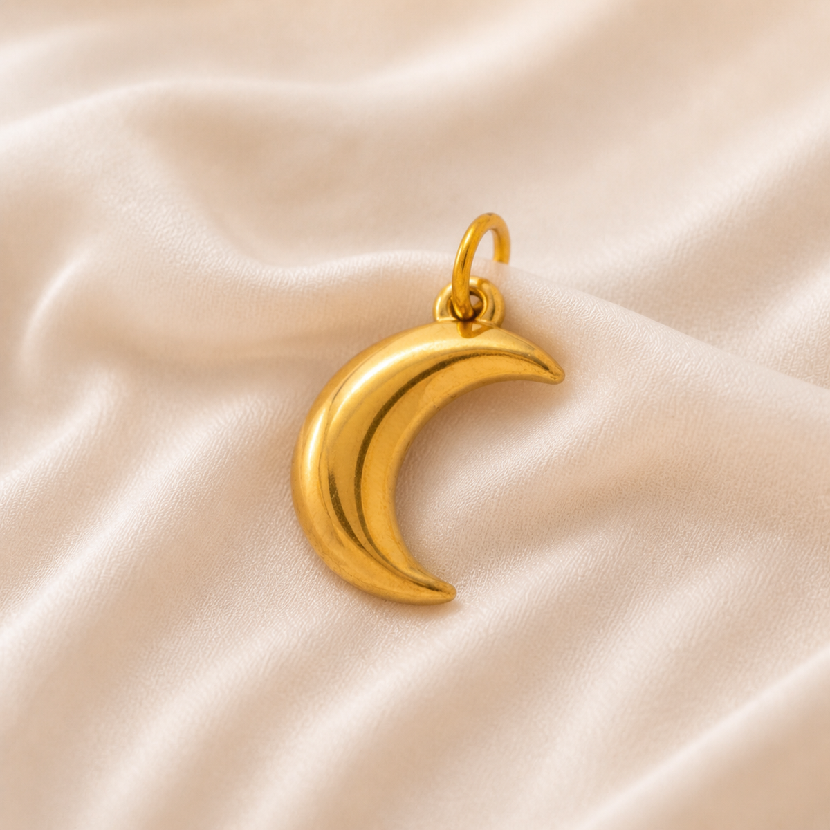 Sculpted Moon Charm styled on Moonveil warm cream silk