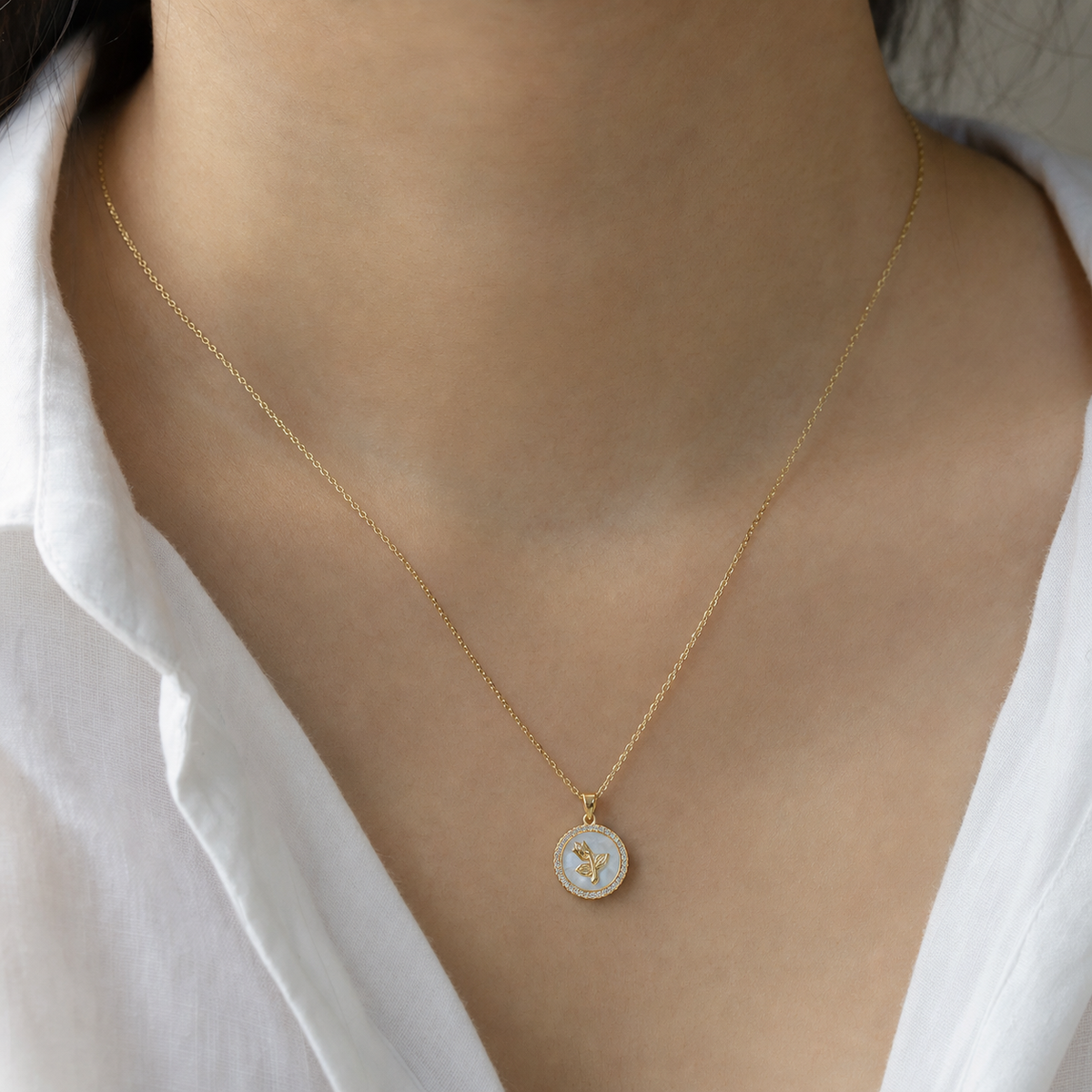 A second photographic styling view of Tulip Seal Shell Pendant Necklace