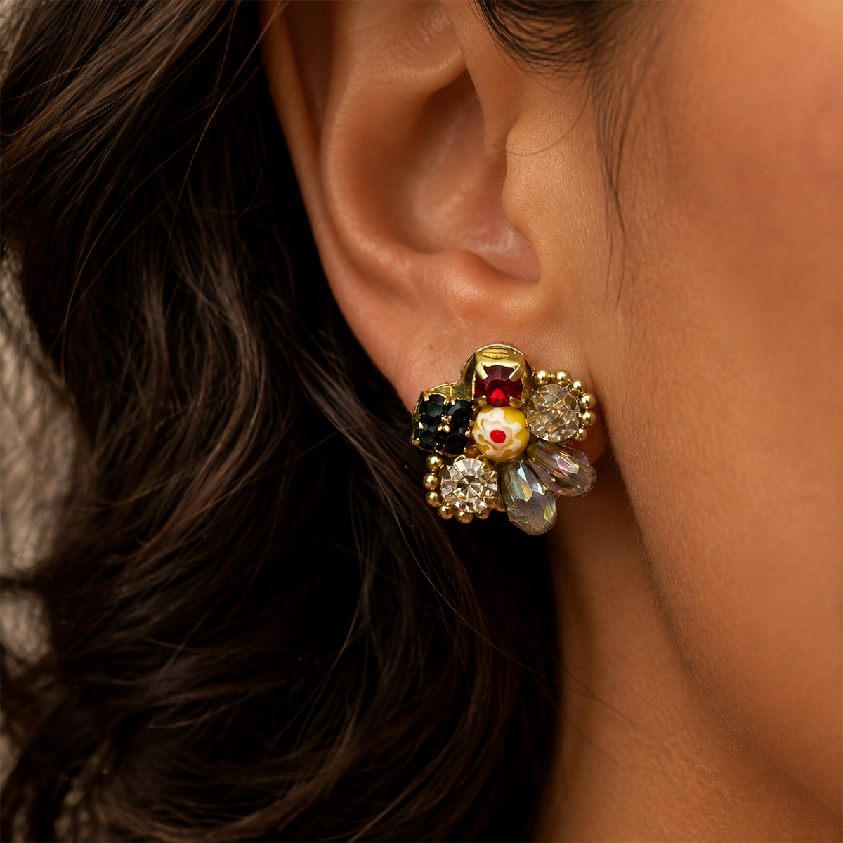 Coronet Blossom Earrings in a close ear-worn view showing the floral stud front and gold-toned visible areas