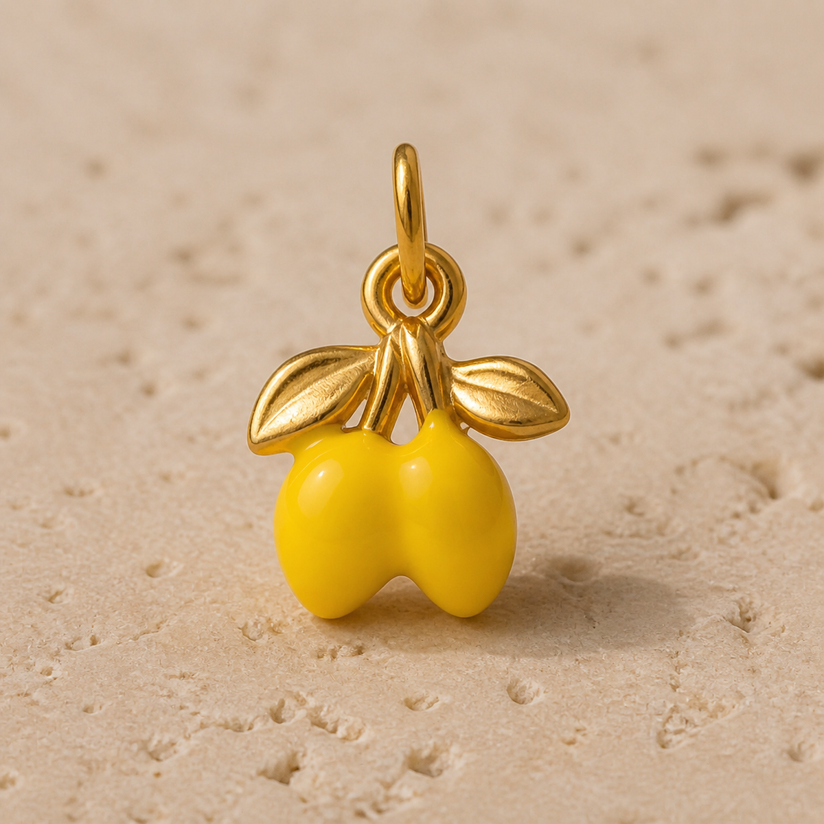 Close-up of Yellow Orchard Charm showing its design and finish