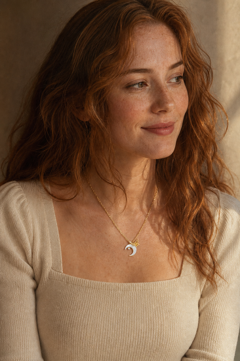 A second photographic styling view of Crescent Wing Shell Pendant Necklace