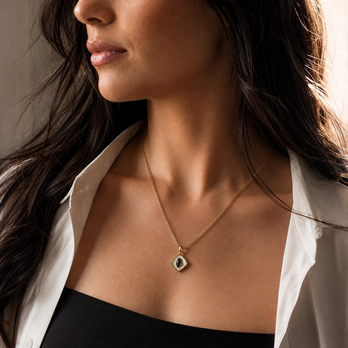 Sable Eclipse Pendant Necklace worn with the diamond-shaped pendant centered below the neckline.