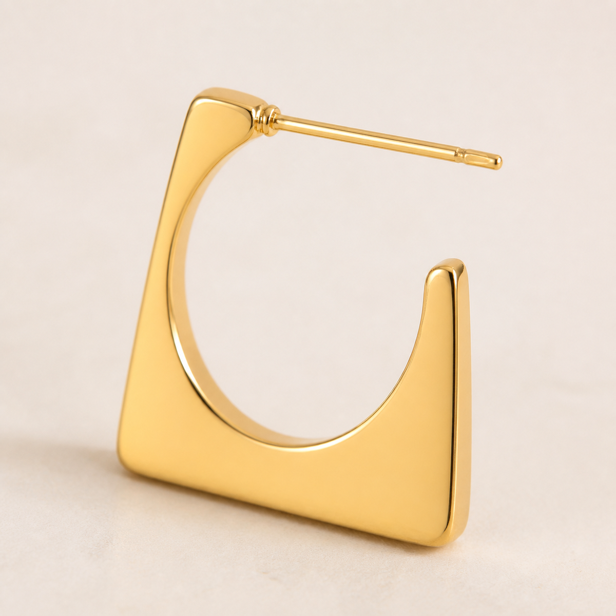 Close-up of the structure and finish of Ember Portal Earrings