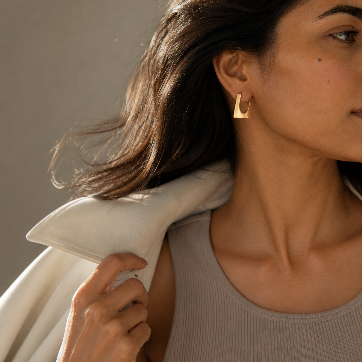 Ember Portal Earrings worn in a shoulder-to-waist turning editorial view