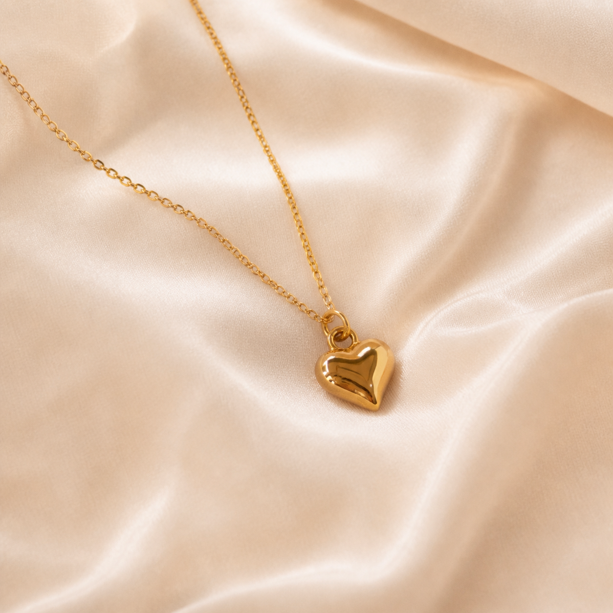 Folded Promise Heart Necklace styled on Moonveil warm cream silk