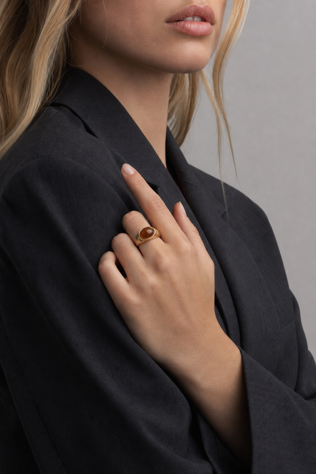 A second photographic styling view of Honeyed Eye Dome Ring