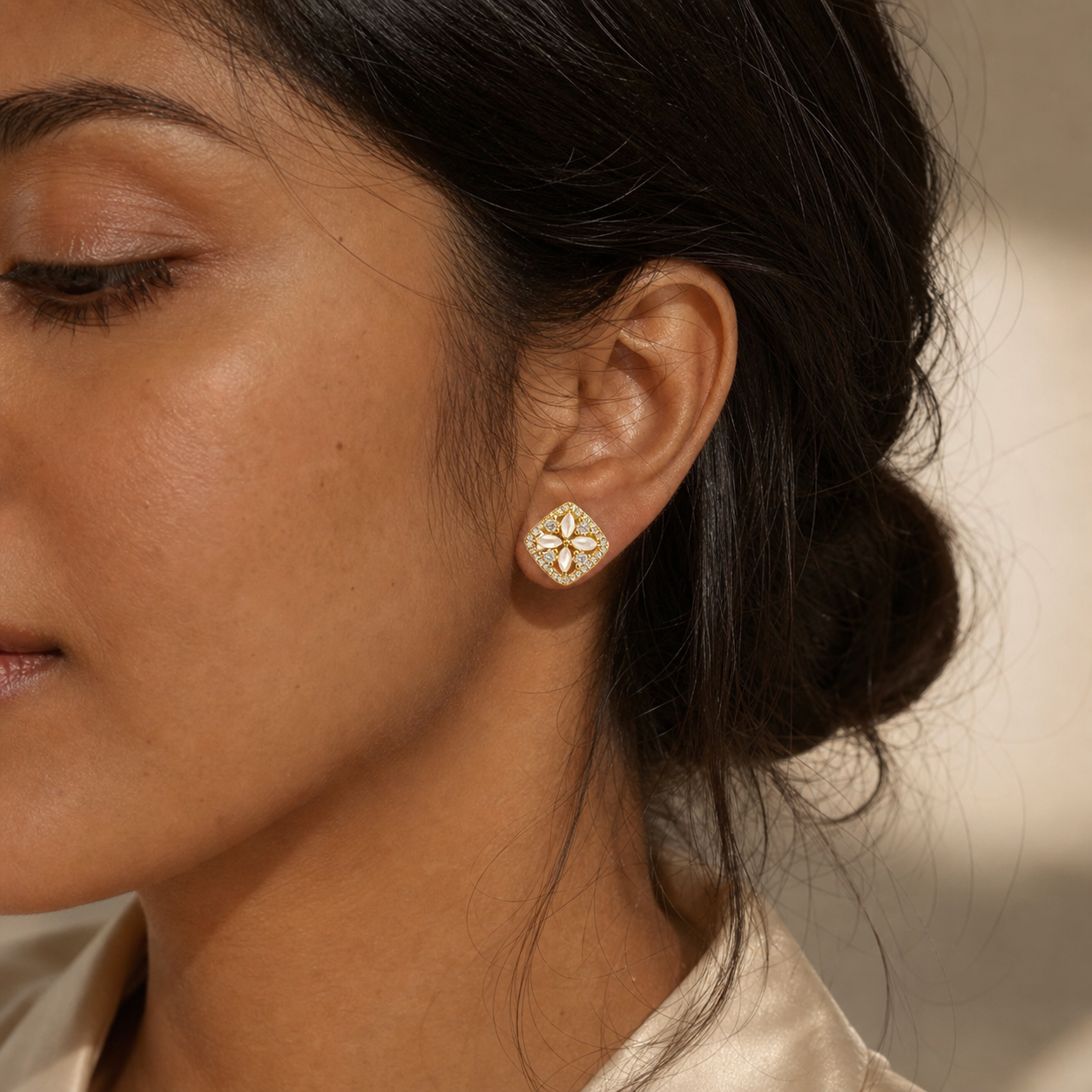 Petaled Window Stud Earrings worn in a natural editorial portrait