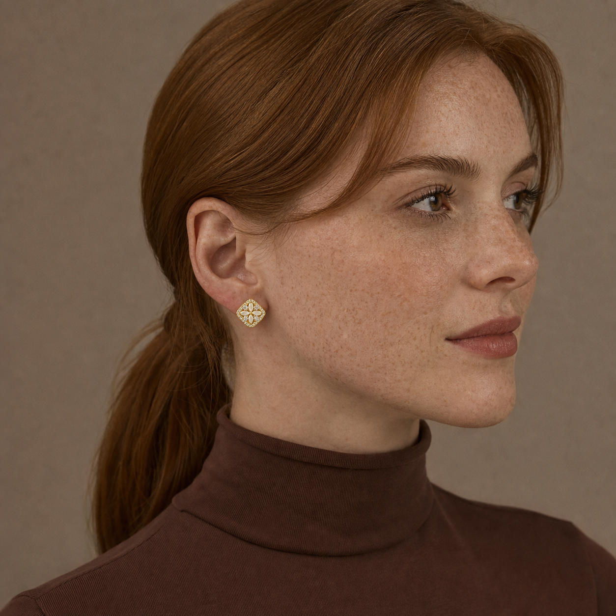 A second photographic styling view of Petaled Window Stud Earrings