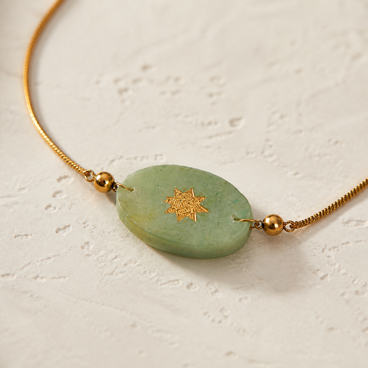 Close-up of Quiet Solar Oval Necklace showing its design and finish