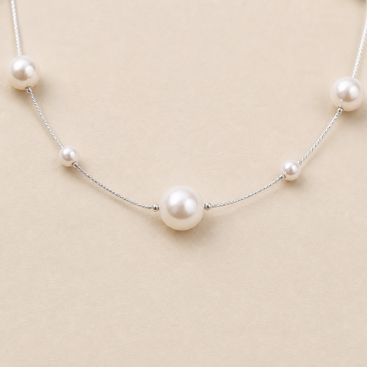 Close-up of Scattered Pearl-Line Necklace showing its design and finish