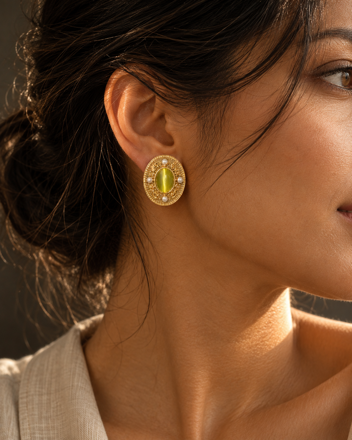 Side-profile editorial view wearing the Viridian Court Earrings