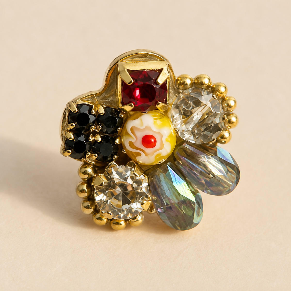 Close-up of Coronet Blossom Earrings showing the paired floral stud front and reflective setting texture